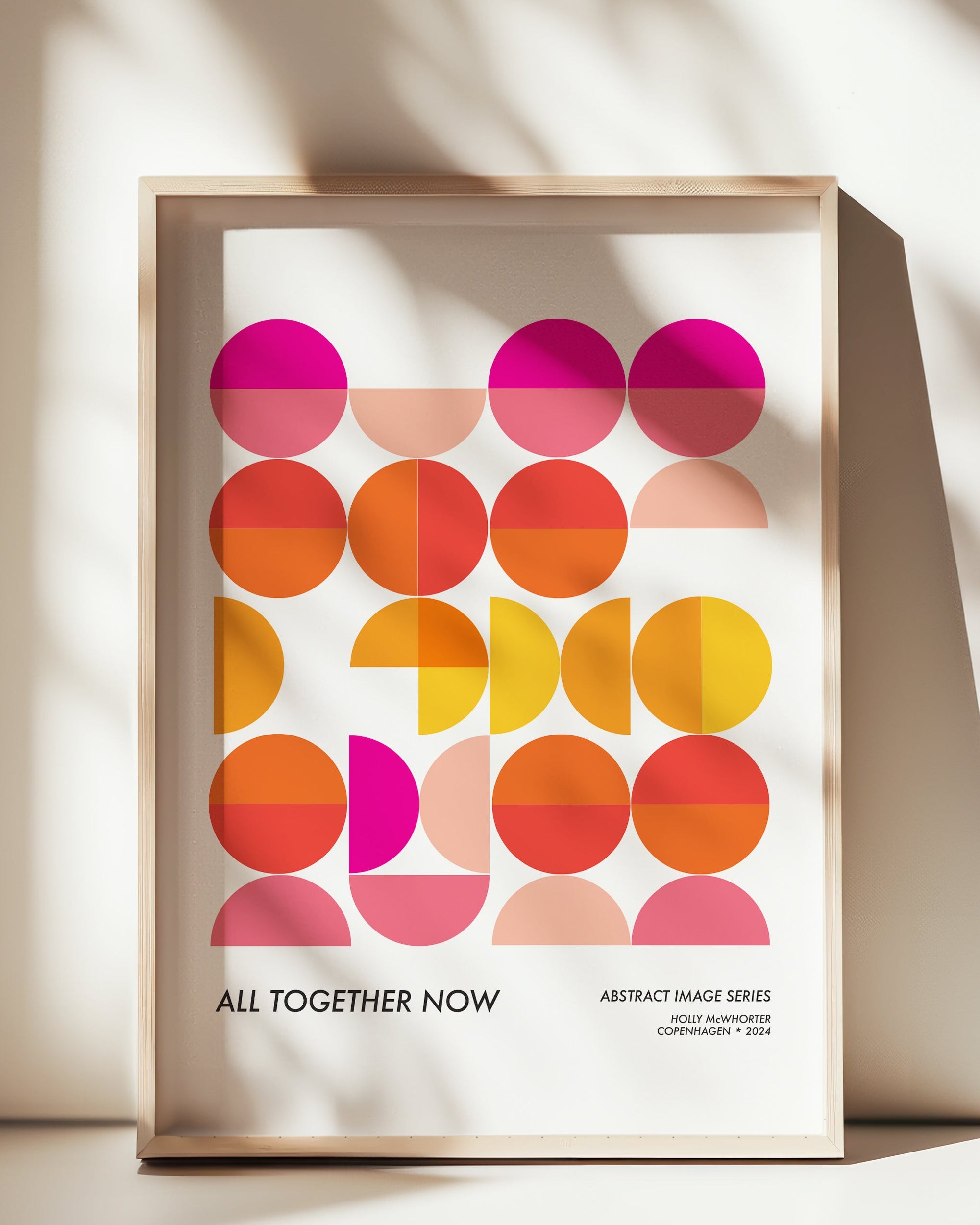 Framed abstract art print with colorful geometric design on a white background