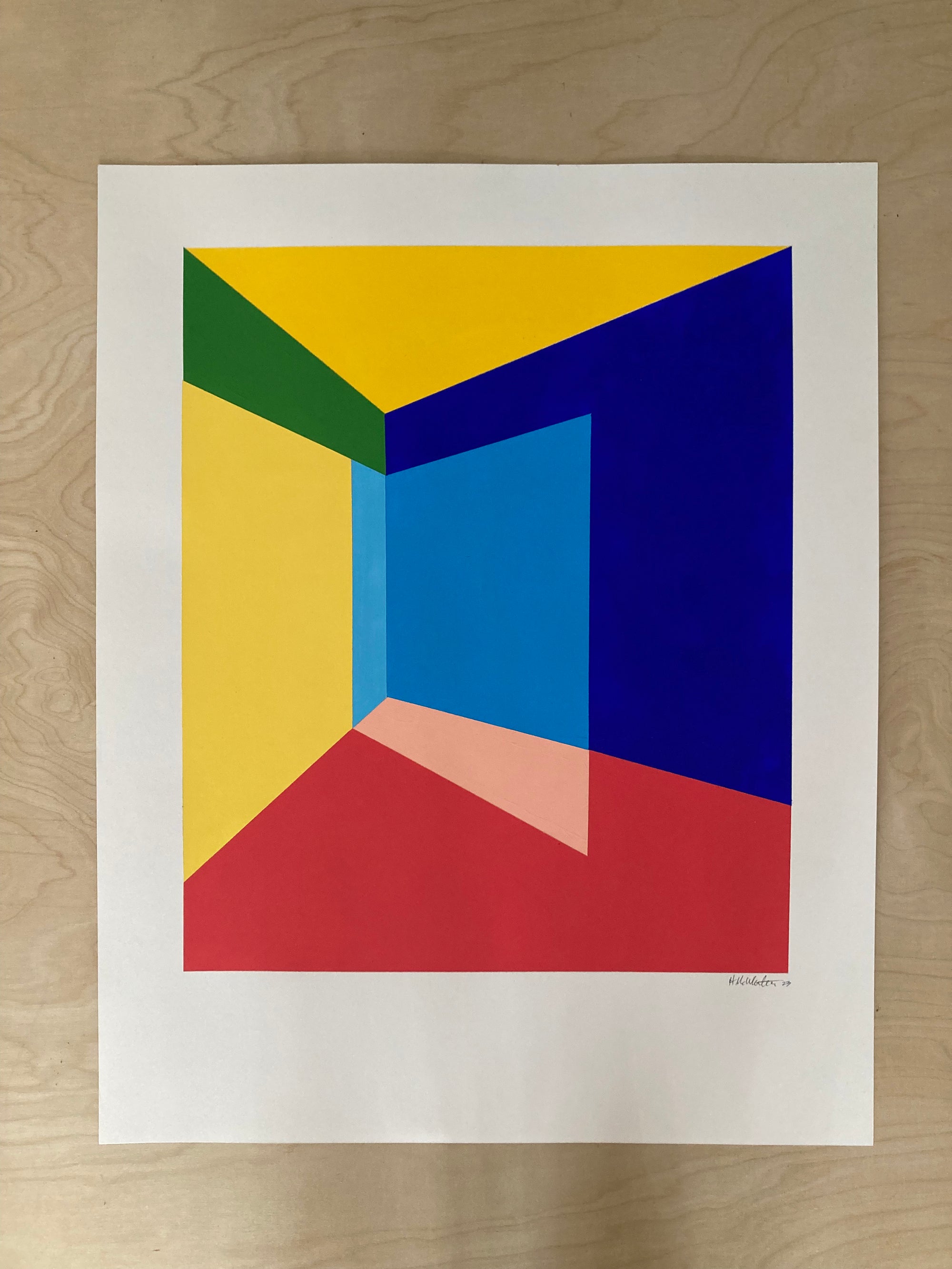 Abstract art print with geometric shapes on a wooden surface